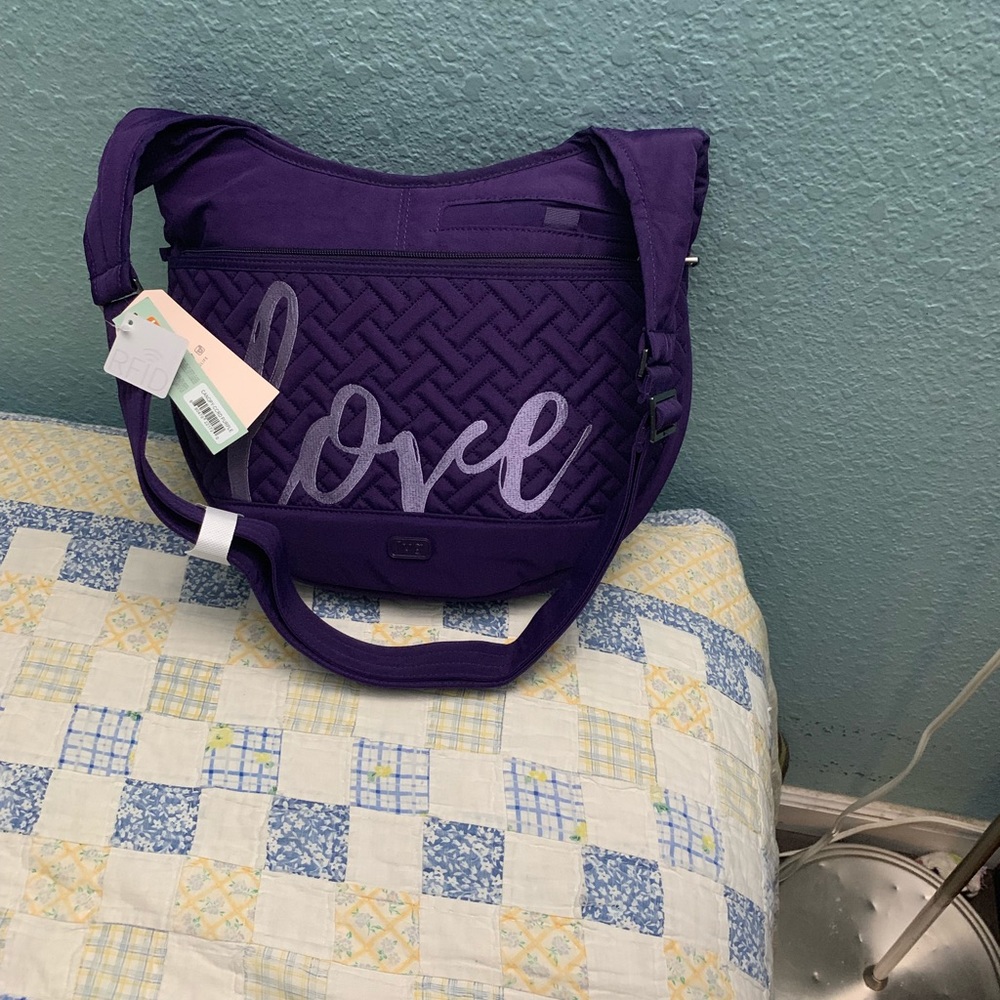 Lug canopy in dark purple color crossbody bag.